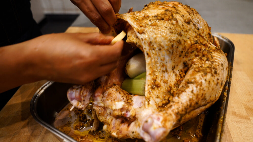 Adding Butter Under Skin to Pavochon, Puerto Rican Style Turkey