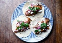 How to Make Easy Vegetarian Chipotle Mushroom Tacos Chipotle Mushroom Tacos topped with cheese and onions