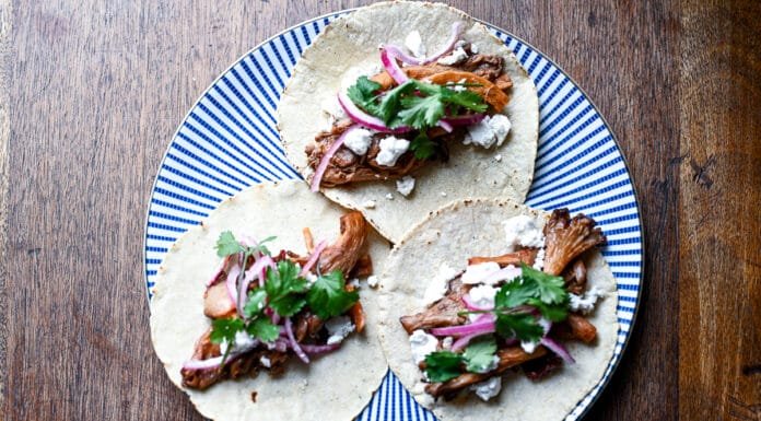 How to Make Easy Vegetarian Chipotle Mushroom Tacos Chipotle Mushroom Tacos topped with cheese and onions