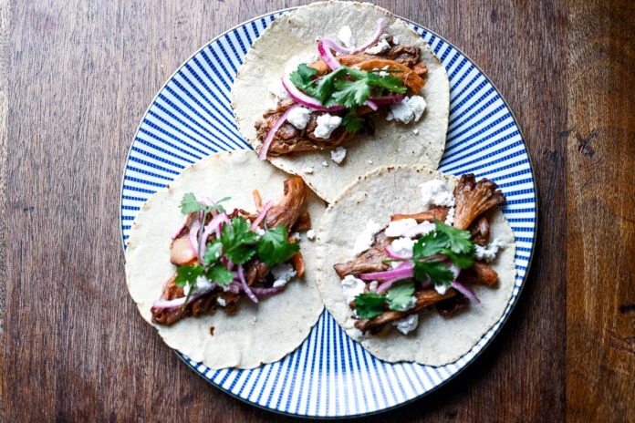 Chipotle Mushroom Tacos-5 Chipotle Mushroom Tacos topped with cheese and onions
