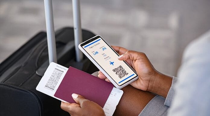 Digital Safety Essentials for Every Traveler vpn for travel woman holding passport and mobile phone