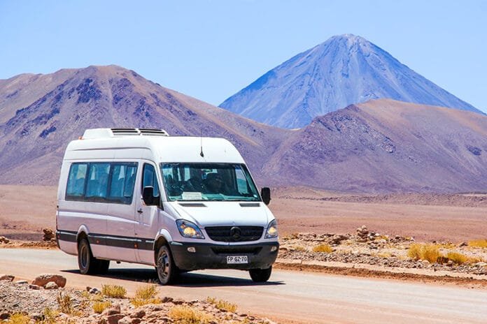 How to Rent a Van Without Breaking the Bank, ANTOFAGASTA, CHILE - NOVEMBER 16, 2015: White minibus Mercedes-Benz Sprinter at the background of a volcano.