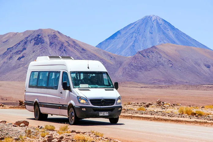 How to Rent a Van Without Breaking the Bank, ANTOFAGASTA, CHILE - NOVEMBER 16, 2015: White minibus Mercedes-Benz Sprinter at the background of a volcano.